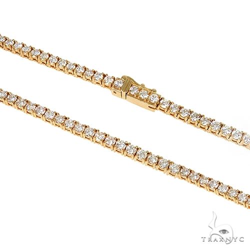 Yellow gold tennis chain with round white diamonds in an elegant 10 pointer setting