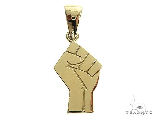 Small 10K yellow gold clenched fist pendant with polished finish and rectangular bail