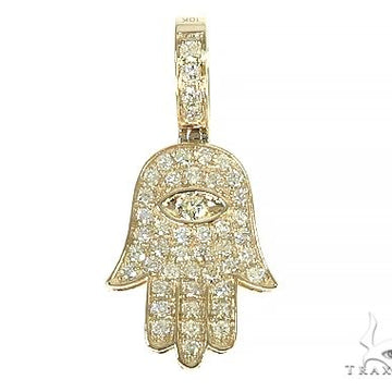 14K yellow gold Hamsa pendant with diamond accents and eye detail.