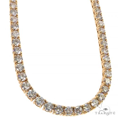 Yellow gold tennis necklace with 12 pointer round-cut diamonds in a classic setting