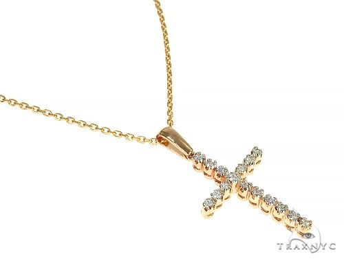 14K yellow gold cross pendant with round diamonds on delicate chain