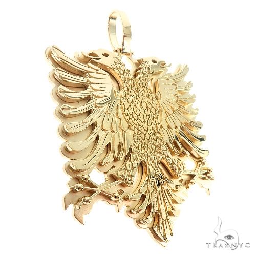 14K yellow gold pendant featuring a detailed double-headed Albanian eagle design