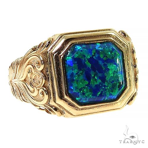Yellow gold men's ring with large rectangular blue opal and intricate engraved details