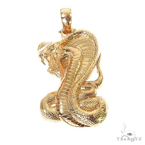 14k gold cobra pendant in coiled strike pose with prong-set stone accents — yellow gold version, front angle
