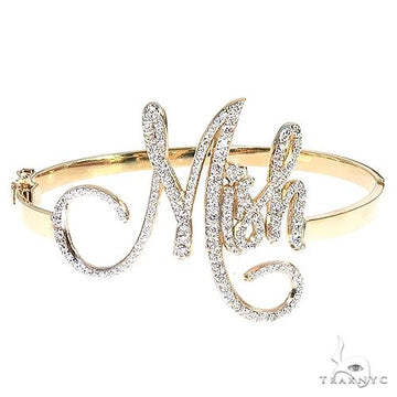 14K gold custom diamond bangle bracelet with round-cut stones set across the band, three-quarter angle view