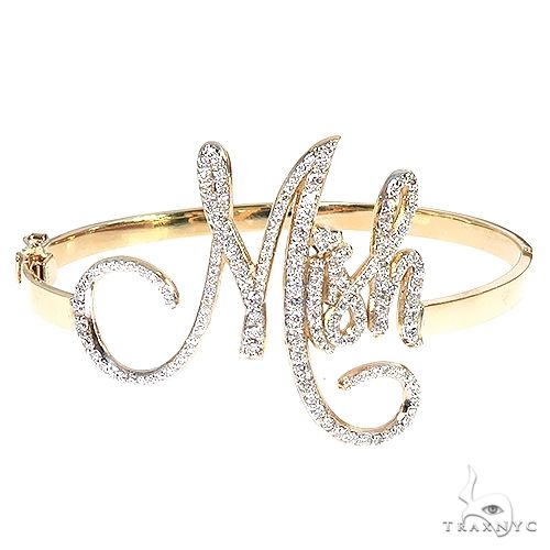 14K gold custom diamond bangle bracelet with round-cut stones set across the band, three-quarter angle view