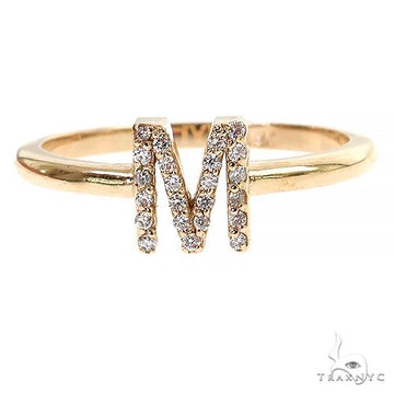 14K yellow gold ring with diamond-studded initial M on a delicate band.