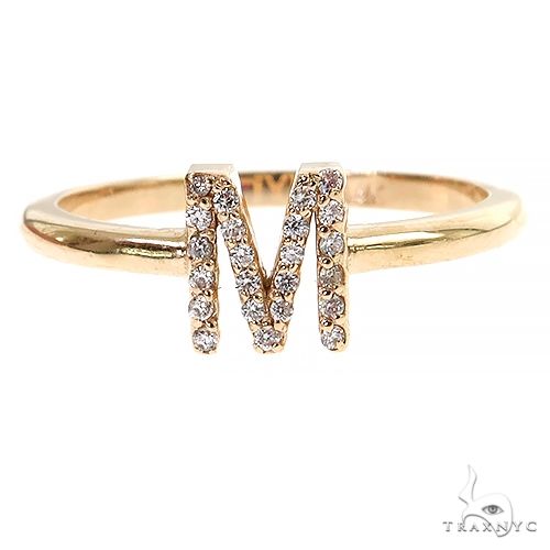 14K yellow gold ring with diamond-studded initial M on a delicate band
