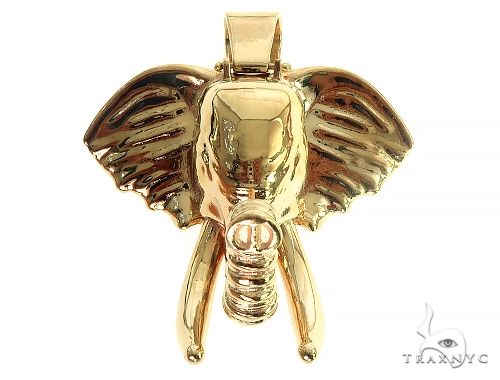 14K solid gold elephant pendant with ruby set eyes, front-facing detail view