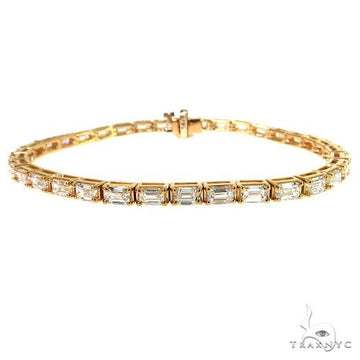14K yellow gold bracelet with linked rectangular emerald-cut lab diamonds.