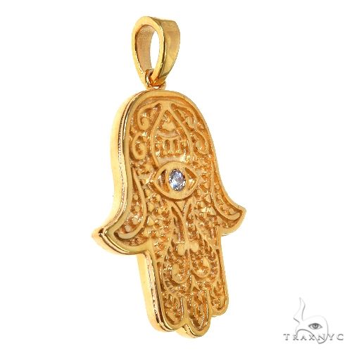 14K yellow gold Hamsa pendant with diamond center and intricate filigree detailing