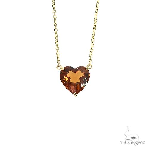 14k gold heart-shaped citrine pendant necklace, front view showing warm amber gemstone in yellow gold setting