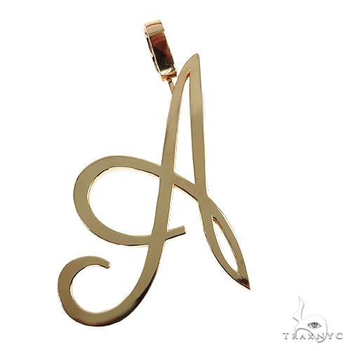 14K yellow gold pendant in a cursive letter "A" design with polished finish