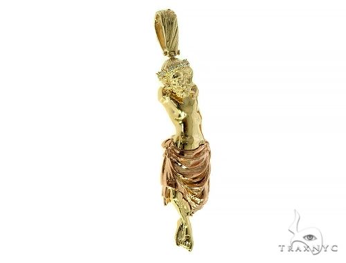 14K gold Jesus crucifix pendant with detailed body and draped cloth in yellow and rose gold