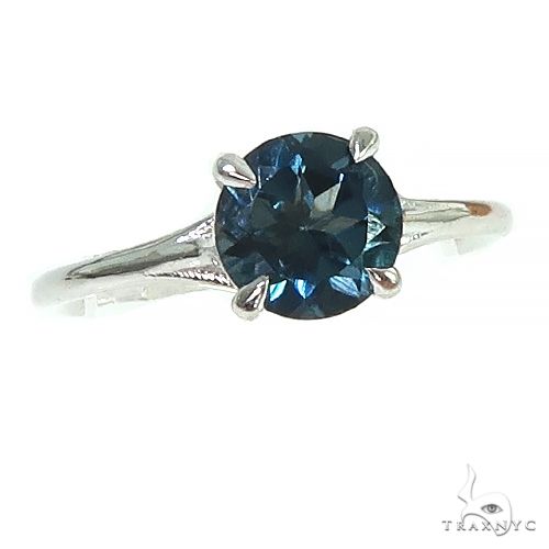 14k gold London blue topaz solitaire ring with prong setting — front view showing deep blue stone