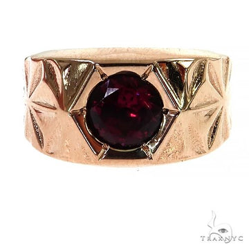 14K rose gold men's ring with round deep red rhodolite gemstone and textured band.