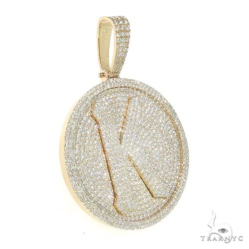 14K yellow gold round pendant with diamond-encrusted letter K design