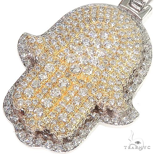 14K gold two-tone diamond Hamsa pendant with detailed filigree and polished edges