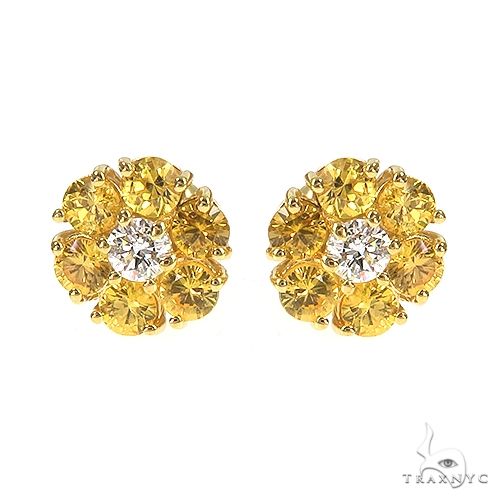 Gold sunflower cluster earrings with central white gemstone and yellow petals
