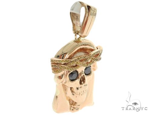 14K rose gold skull pendant with prong bezel diamonds and crown of thorns detail