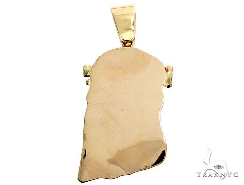 14K yellow gold skull pendant with smooth polished finish and prong bezel diamond accents