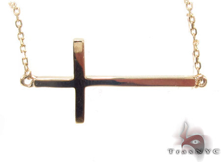 14K yellow gold cross necklace with polished finish