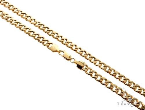 14k yellow gold hollow Cuban curb link chain 5.5mm wide, 28 inches, flat-link profile on white background