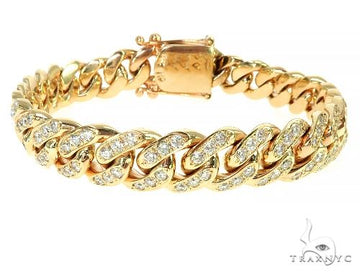14k yellow gold one-row diamond Cuban link bracelet – prong-set round diamonds across the top, flat profile view