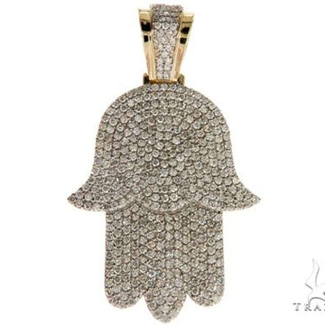 14K yellow gold Hamsa pendant encrusted with pave diamonds in detailed hand shape.