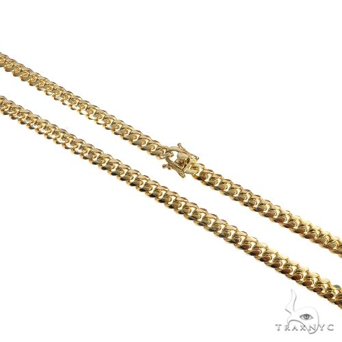 14K yellow gold solid Miami Cuban link chain 26 inches long, 7mm wide, polished finish