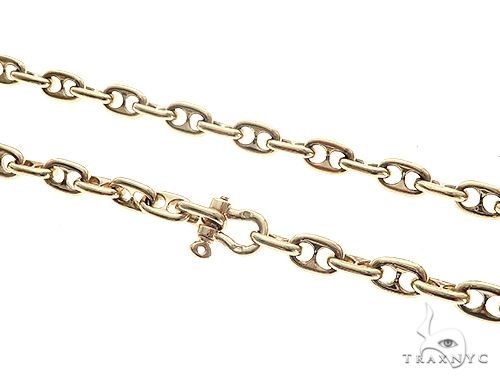Solid 14k yellow gold puffed anchor link chain, 6mm width, 25 inches, high-polish mirror finish, flat lay view