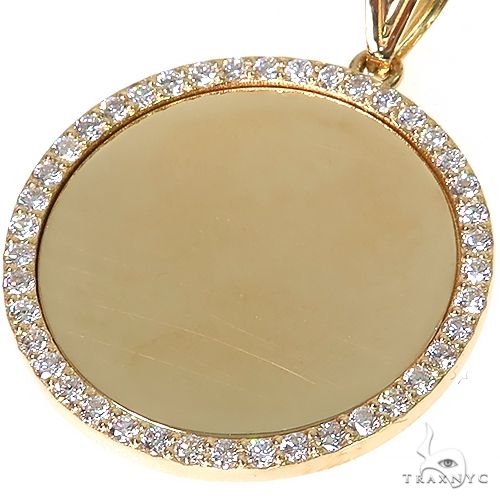 14K yellow gold round pendant with diamond bezel and smooth center for photo insertion