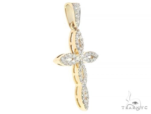 14K yellow gold cross pendant with twisted design and sparkling diamond accents