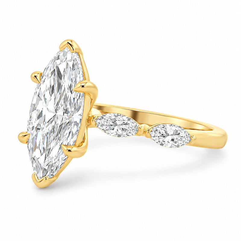 14K yellow gold marquise diamond engagement ring featuring a 2.50 carat marquise-cut lab grown center diamond, four marquise side stones, and distinctive tab and claw prongs