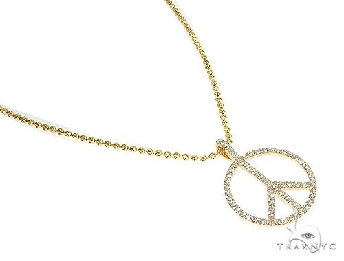 14k yellow gold peace sign pendant with diamond accents on a delicate chain