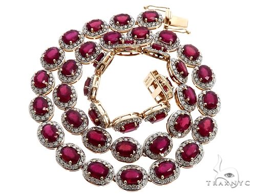 14k yellow gold ruby and diamond necklace – front view showing ruby center stone with diamond accents on yellow gold setting