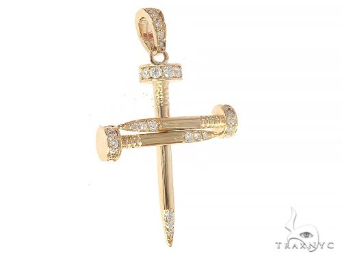 14k yellow gold cross pendant shaped like nails with diamond accents.
