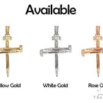 14k yellow gold cross pendant shaped like nails with diamond accents.