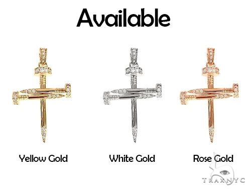14k yellow gold cross pendant shaped like nails with diamond accents.
