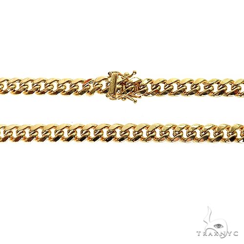 14k yellow gold hollow Miami Cuban link chain 6.6mm wide, 24 inches long.