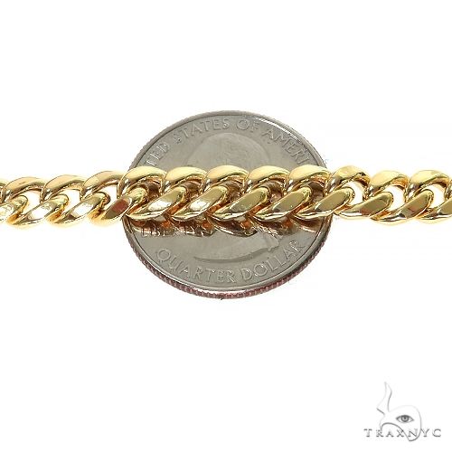 14k yellow gold hollow Miami Cuban link chain 6.6mm wide, 24 inches long.