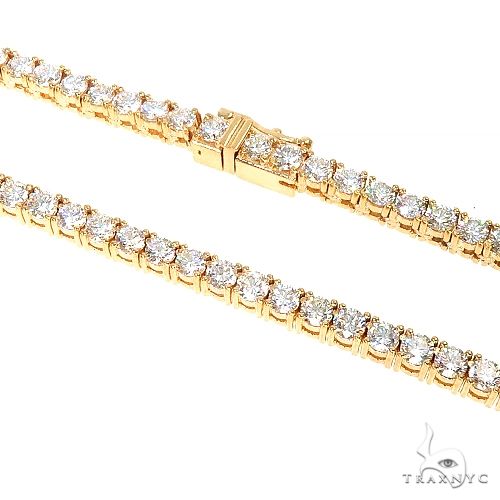 Yellow gold diamond tennis chain necklace with round-cut stones in a classic setting