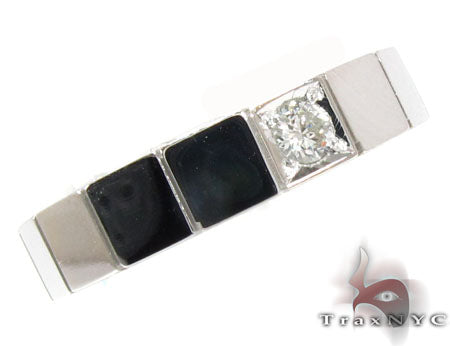 White gold men's ring with square black onyx inlays and a prong-set round diamond center