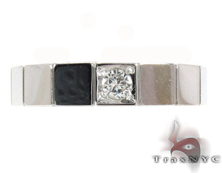 White gold men's ring with square black onyx inlays and a prong-set round diamond centerpiece