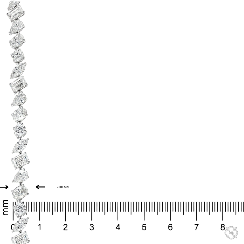White gold diamond tennis chain with multi-shaped stones in a continuous link design.