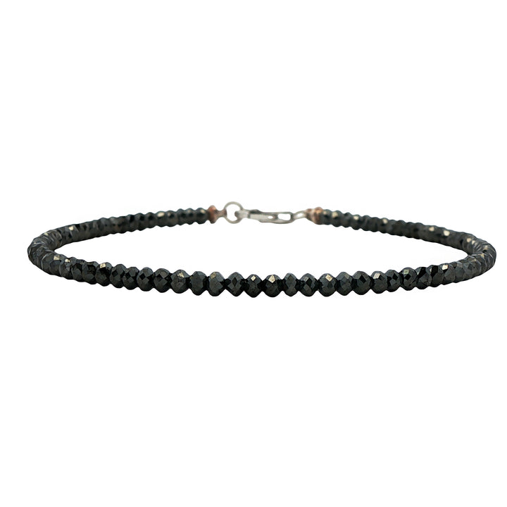 Black diamond bead bracelet with silver clasp, sleek and minimal men's jewelry accessory.