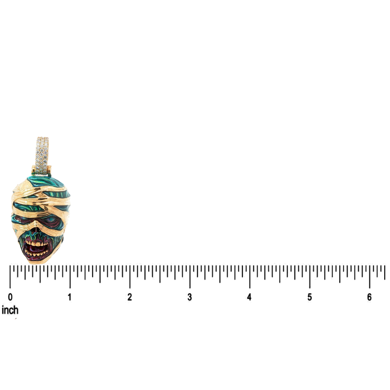 Gold mummified zombie pendant with diamonds and green glow-in-the-dark enamel detailing.