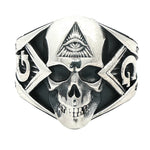 Silver skull ring with all-seeing eye pyramid and geometric details, matte finish.