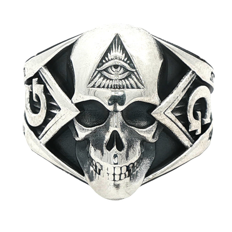 Silver skull ring with all-seeing eye pyramid and geometric details, matte finish.