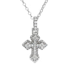 White gold mini cross pendant with sparkling diamond accents on chain.